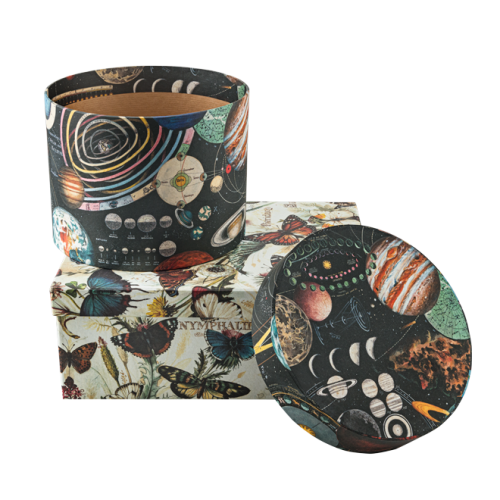 Decorative round boxes wrapped in cosmic and botanical vintage papers